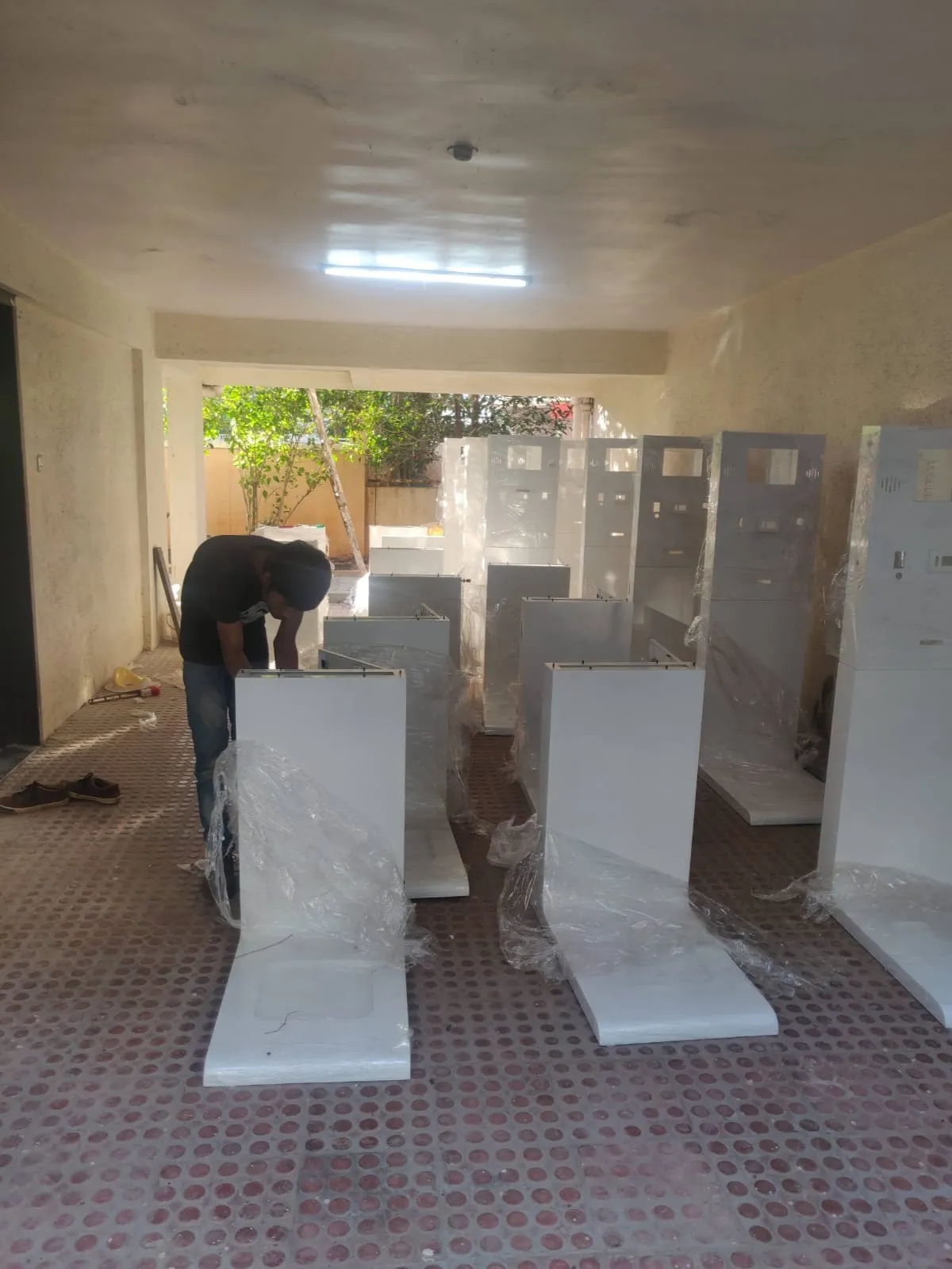 Finished health kiosk units being wrapped for dispatch from the first assembly space