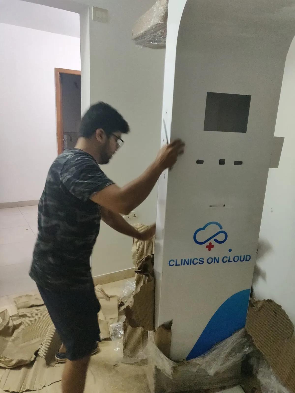 Early Clinics On Cloud health kiosk being finished by hand in the founders' 2 BHK apartment
