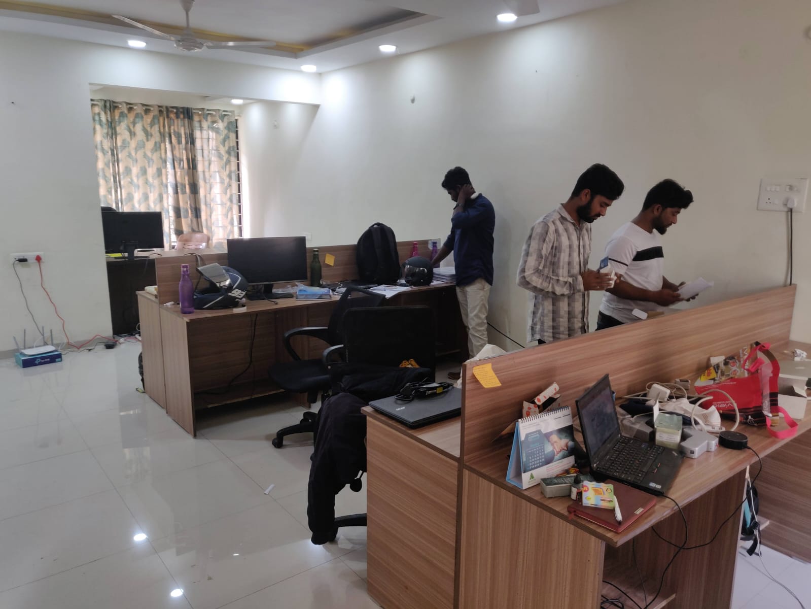 Staff setting up desks in the first Clinics On Cloud office
