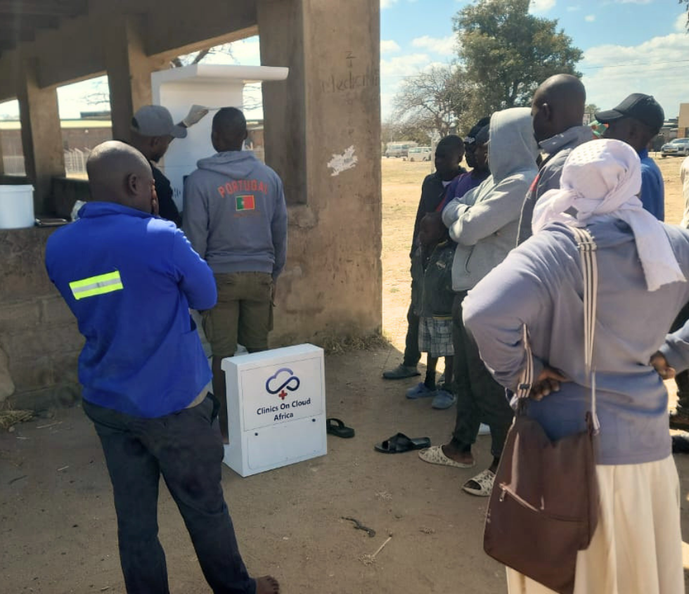 Clinics On Cloud Africa community health screening deployment with residents queuing at an outdoor kiosk