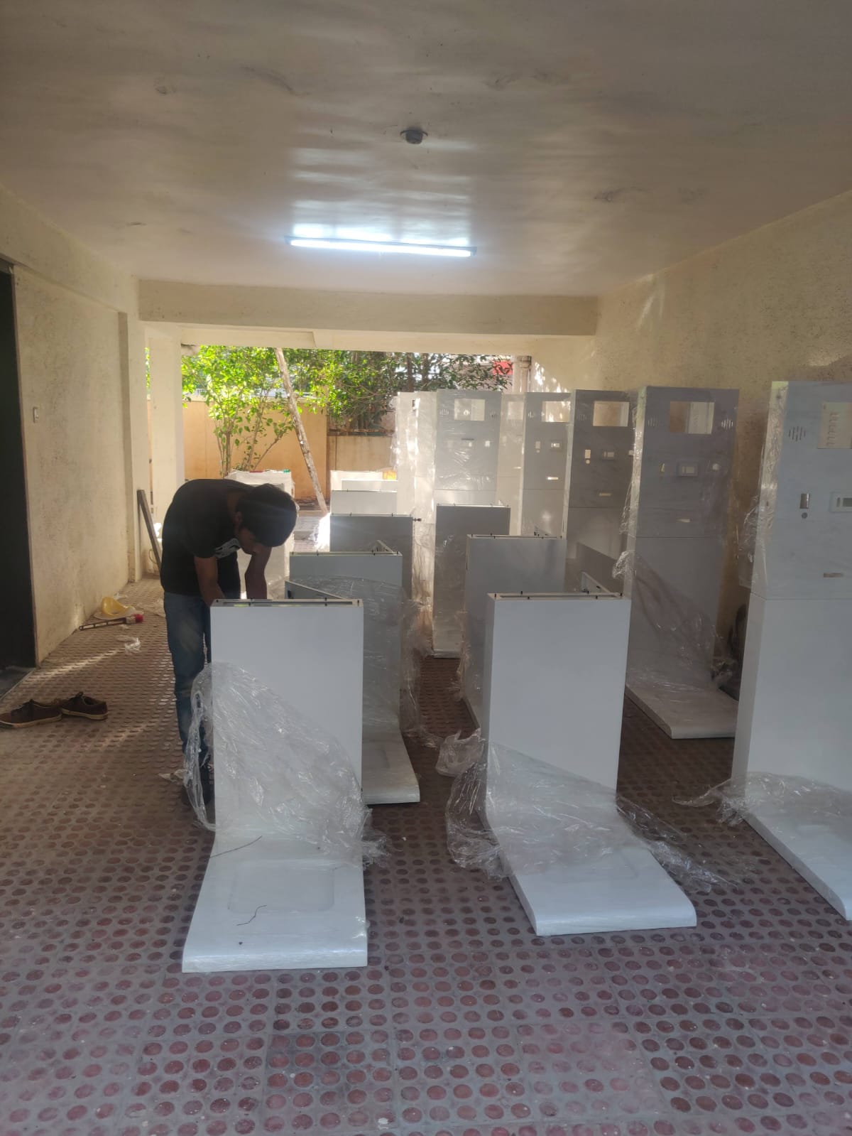 Finished health kiosk units being wrapped for dispatch from the first assembly space