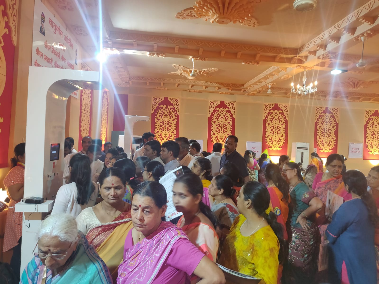 Women queuing for free screening at Clinics On Cloud health kiosks during a community event