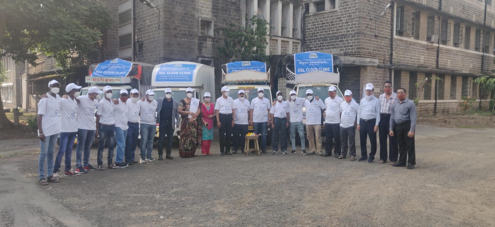 The team with Clinics On Cloud mobile medical units before dispatch