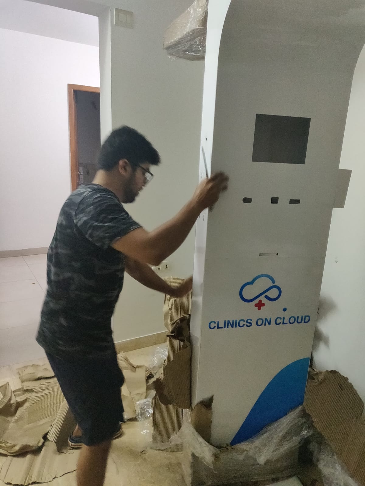 Early Clinics On Cloud health kiosk being finished by hand in the founders' 2 BHK apartment