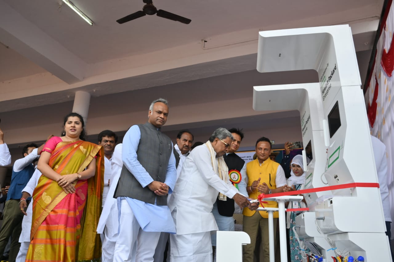 Government officials inaugurating a health kiosk under a CSR-led community screening initiative